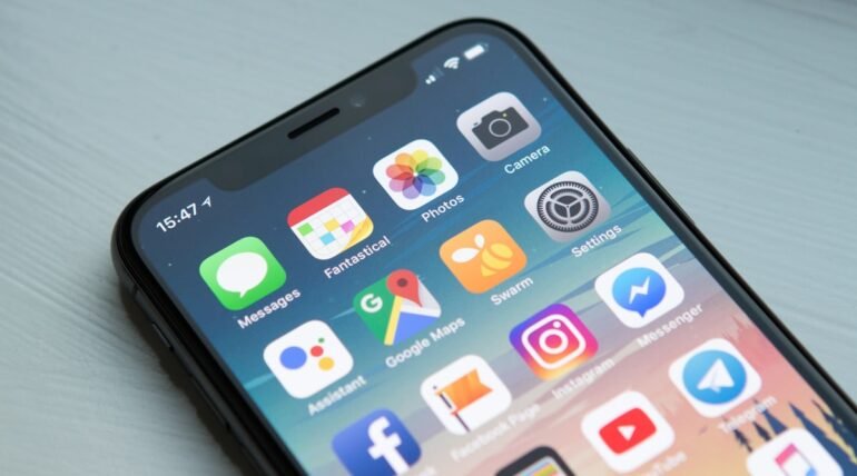 Mobile app development on smartphone and laptop